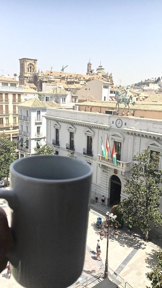 Enjoying a complimentary coffee and an amazing view from The Nest in Granada