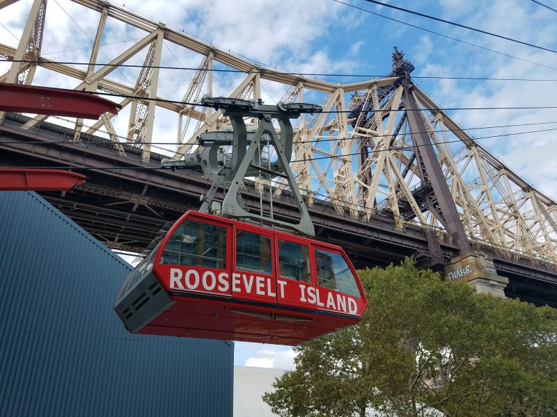 Take the Roosevelt Island Tram from Manhattan at the cost of a subway ride.