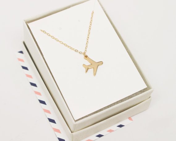 gold airplane necklace