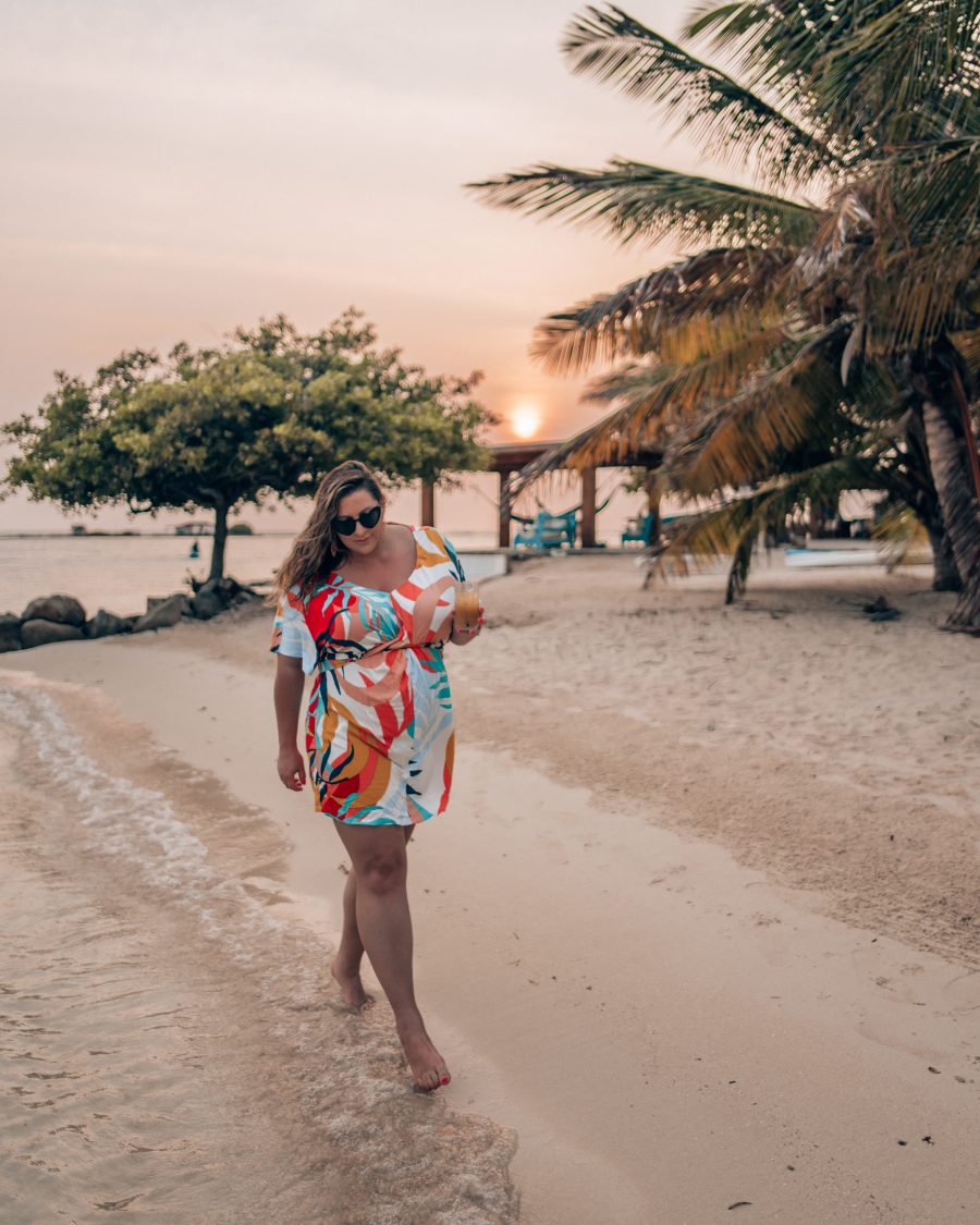 Walking by the beach at sunset at the best resort in Aruba!