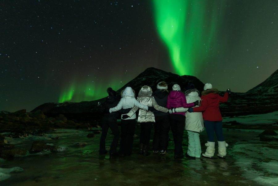 A group of people witnessing the beauty of the Northern Lights in Norway #NorthernLights #Norway
