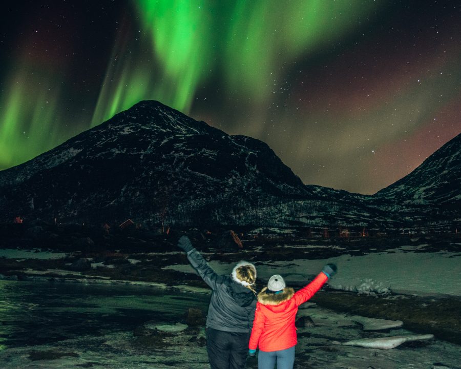 Two people watching the Northern Lights in Norway #NorthernLights #Norway