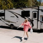 girl in front of her RV